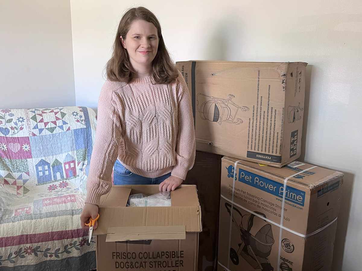 opening packages of cat strollers